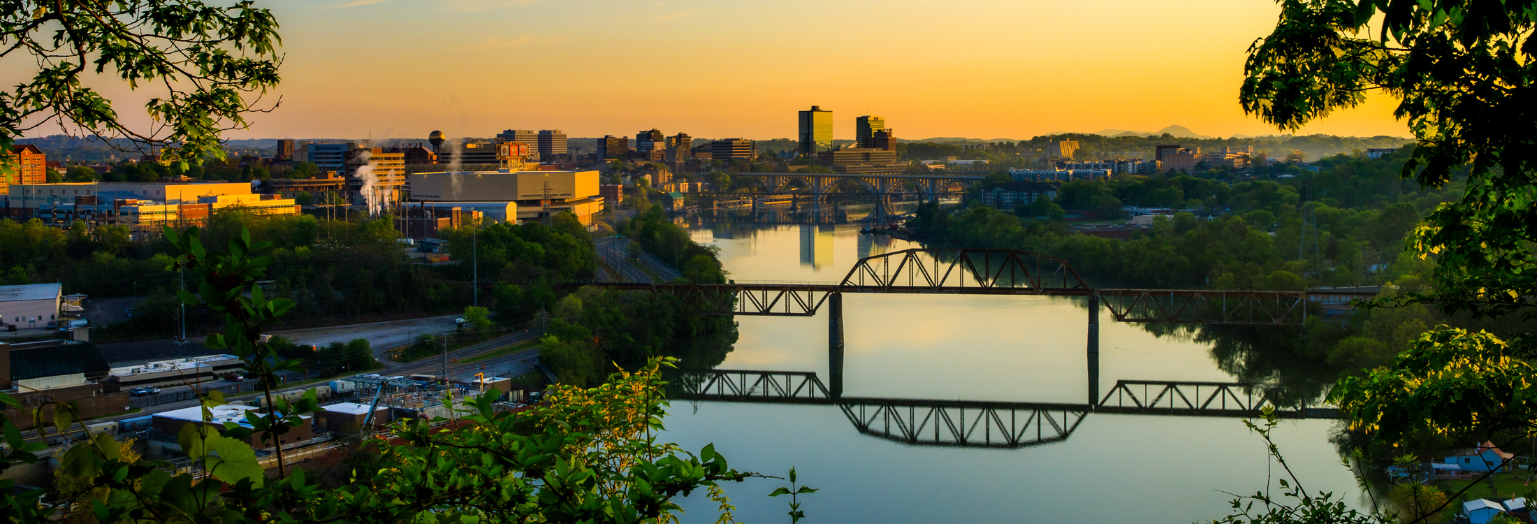 Sun rises over the Tennessee River, Knoxville, and the UT campus